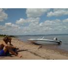 Duluth: : Boat on Park Point beach. Jordan Riesgraf contemplating on jumping in despite the frigid water temperatures ; )