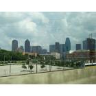 Dallas: : Downtown from I-35E. The American Airlines Center is at the right center and the DART tarin is below it.
