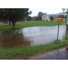 Hooks: : Flooded ditch overflowing into yard on Browning