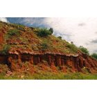 Turkey: VISIBLE STRATA along Prairie Dog Town Fork Red River were deposited during the Permian and Triassic periods when the area was a sea. Consisting mostly of unconsolidated, deep-red, slightly calcareous shaly clay, these Permian 