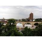 Minneapolis: : famed landmark James J. Hill Arch Bridge over the Mississippi River at near flood stage