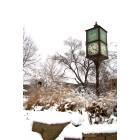 Winona: : The clock tower on the Winona State University campus after a March snow