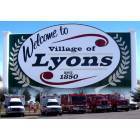 Lyons: Lyons city sign with fire truck fleet