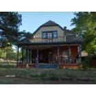 Guthrie: picture of historical victorian era house with gingerbread detail still intact