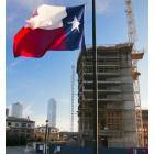 Dallas: : Texas Flag Waves in Front of W Hotel construction