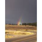 Somers: just driving down the road after a short rain we spotteda huge rainbow