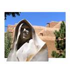 Santa Fe: : One of many beautiful sculptures with adobe style building.