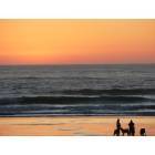 Cannon Beach: a family enjoying sunset at the beach