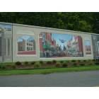 Catlettsburg: This is a floodwall murial of the centennial parade of our town, Catlettsburg Kentucky. The wall depicts more paintings of great times and people from our town.