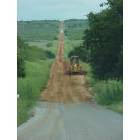 Waurika: Bulldozer working on country road in Waurika