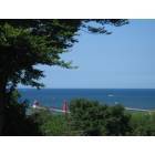 Grand Haven: : View of the famous Grand Haven lighthouse and pier from my Uncle's backyard.