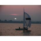 Plattsburgh: : Soling Sailboat glides home against the City of Plattsburgh skyline