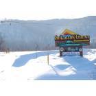 Soldiers Grove: Solar town sign snow drifts