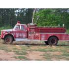 Fort Deposit: Old firetruck outside our new station.