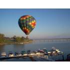 Clarksville: : Taken from the Moorings Condominiums.Hot air baloon touch down in the water.