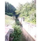 Coshocton: Erie Canal locks were 90 feet long and 15 feet wide, and were designed for a canal boat 61 feet long and 7 feet wide, with a 3 1/2 foot draft.