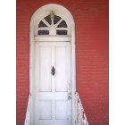 Calvert: white door on red brick