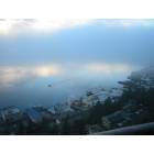 Ketchikan: A floatplane taxis out of a fogbank over a mirror-like Tongass Narrows