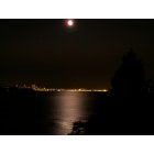 Bainbridge Island: : this is a picture from on bainbridge island, looking out to the bay over near seattle, captureing the moonlight, and its reflection in the bay, this was taken at my uncles house during a trip to seattle