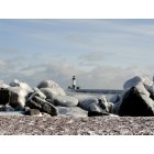 Duluth: : Lighthouse and ice covered rocks on Lake Superior in Duluth, MN