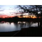Paola: A Sunset over a pond in Paola