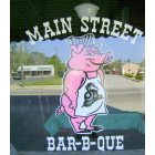 Branchville: Branchville, SC's, Main Street Bar-B-Que Restaurant store-front window logo, with reflections of business and parking lot across Main Street.