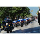 Milwaukee: : Officers riding Harley Davidson Motorcycles down Wisconsin Ave for the 105th Anniversary of Harley Davidson