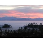 Cottonwood: Lassen Peak and southern Cascades behind foggy Sacramento Valleyat sunrise