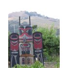 Powers: Beautiful totem pole in the downtown residential area of Powers showing the mountains surrounding this historic valley