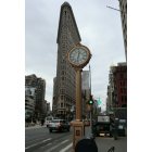 Manhattan: : Fifth Avenue Building Clock and the Flatiron Building - both landmarks of nyc