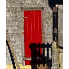 Lubec: A brightly painted red door at the Smokehouse museum.