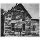 Beaver City: Two-story log house from the 1880s, still standing southwest of Beaver City, Nebraska