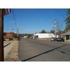 Centreville: A picture of downtown Centreville, MS; Washerteria to your far right with the two cars parked