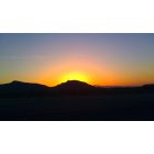 Henderson: sunset behind black mountain