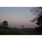 Berryville: full moon at sunset