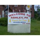 Ashley: Welcome sign located next to the Ashley Municipal Building on Main street.