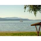 Bellingham: : View of Lummi Island, sailboat, and a hammered dulcimer at Marina Park in Old Fairhaven