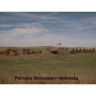 Merna: Patriotic Midwest showing the American Flag in hay bales along the highway.