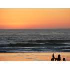 Cannon Beach: : a family enjoying sunset at the beach