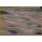 Arial veiw of Waynoka's Little Sahara Sand Dunes with several riders a top each of the dunes.