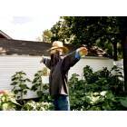 An ex-Amish man makes use of his last Amish clothes to protect his raised gardens