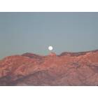 Albuquerque: Moonrise and Sunset Over Sandia Mountain in Albuquerque, NM