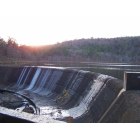 Wilburton: View of the spillway and setting sun at Robbers Cave State Park
