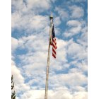 Orting: Photo taken during town parade for Christmas, walking around town. Our flag stands tall and sky is blue! Amazing sight.