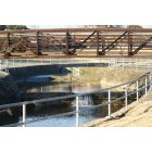 Carrollton: water flow under the bridge on the greenbelt in Carrollton