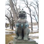 Sheridan: Oriental Lion Statue in park in Sheridan