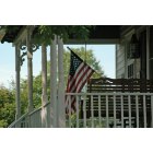 Leesburg: Flag on porch at Ida Lee Park Farmhouse in Leesburg