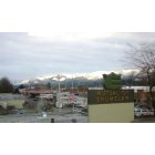 Enumclaw: : A snowy Cascade Mountain Range taken from the top of Mutual of Enumclaw Insurance Co.