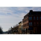 Menominee: a view southward down historic 1st St during winter partly cloudy skies