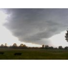 Altus: this was taken june 7th of 2010 between atus and coaln hill! a single cloud hovering over the field as the tail dropped and i was driving by...i stopped in awe and took the pic